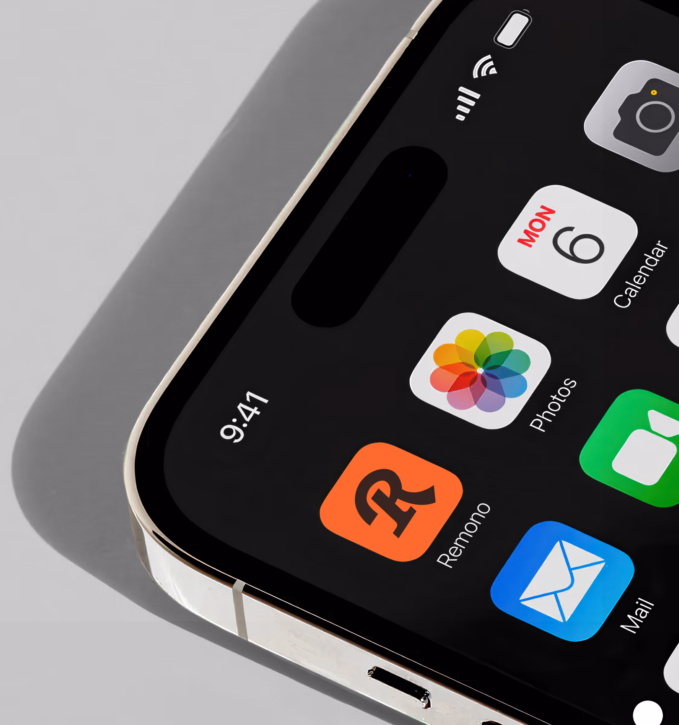Close-up of an iPhone home screen with the orange Remono app icon