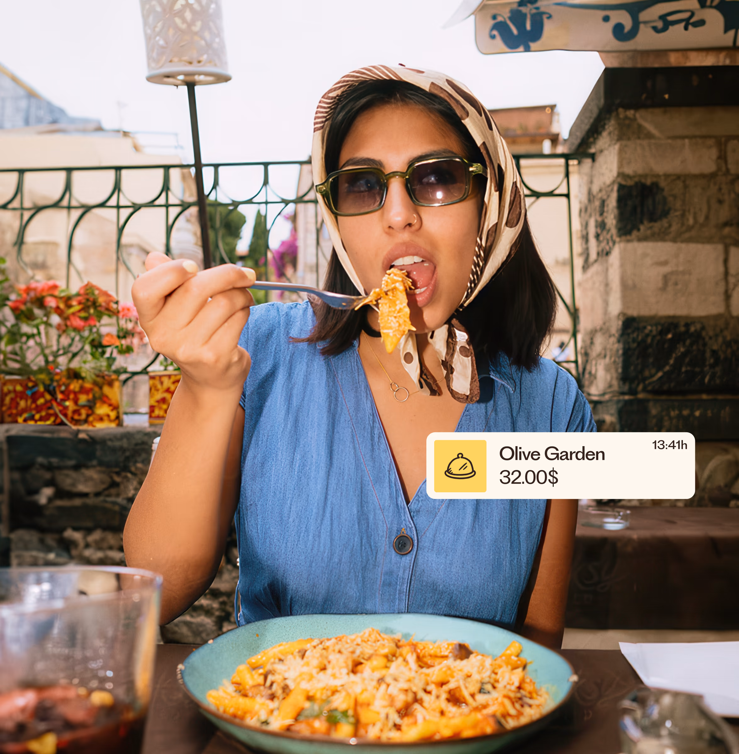 Woman eating at a restaurant with a Remono notification showing the meal payment