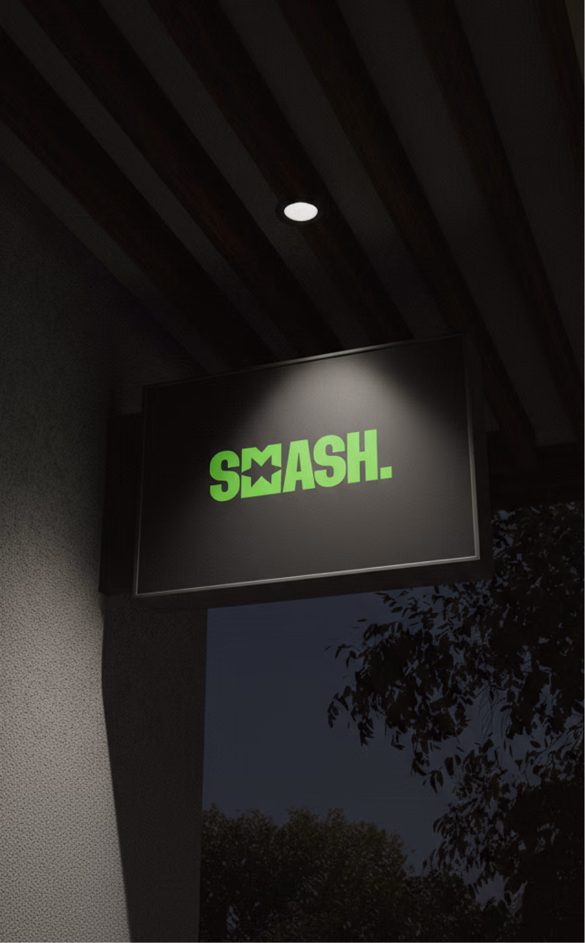 Black shop sign lightbox at night with the Smeash wordmark glowing in green