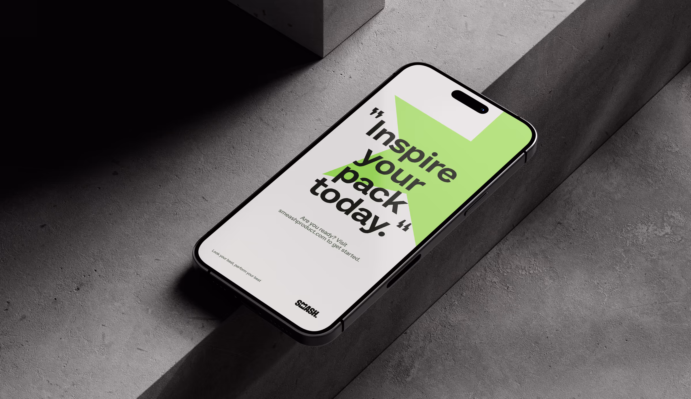 Phone on concrete showing a Smeash graphic reading Inspire your pack today