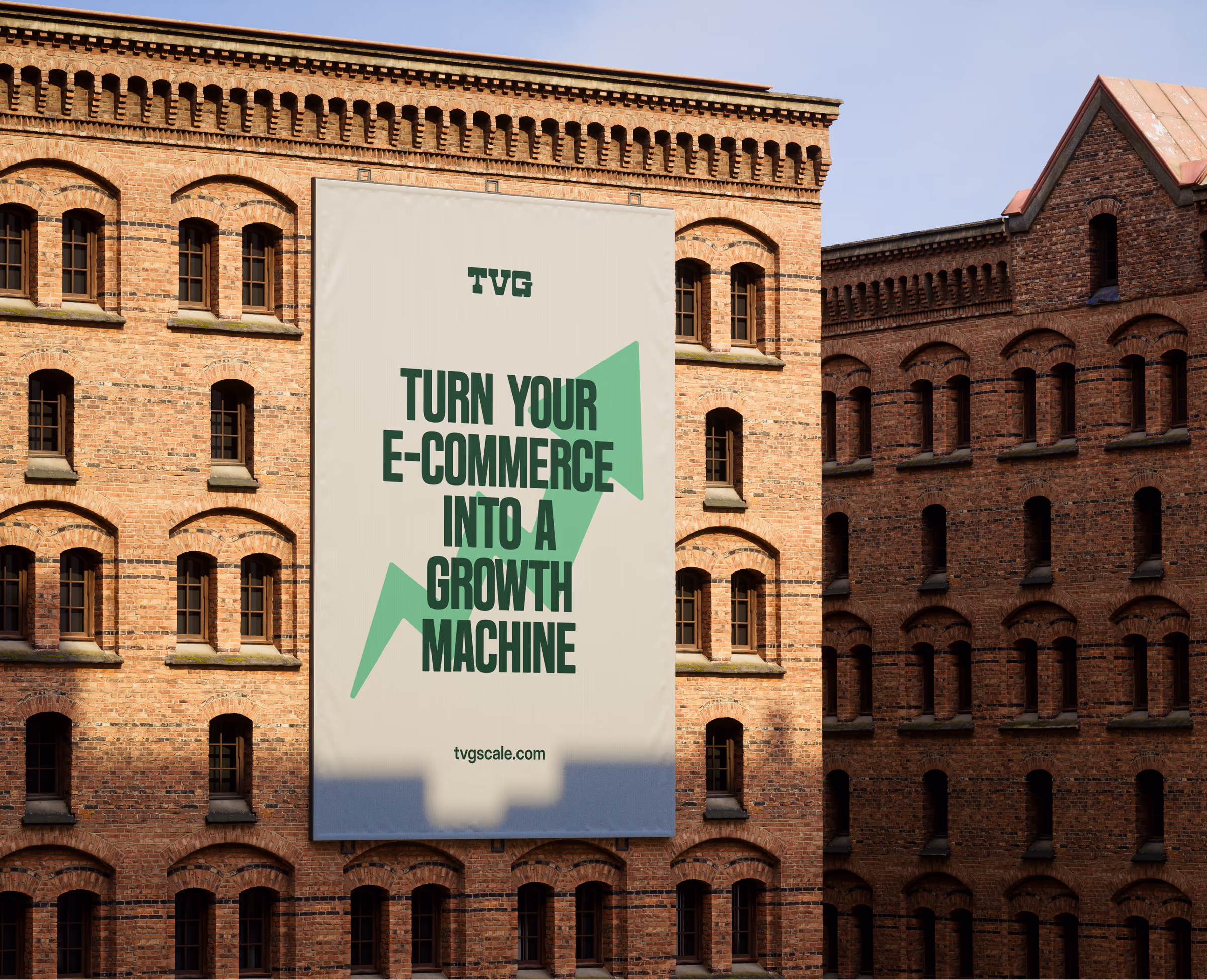 Large TVG banner on a brick building reading Turn your e-commerce into a growth machine